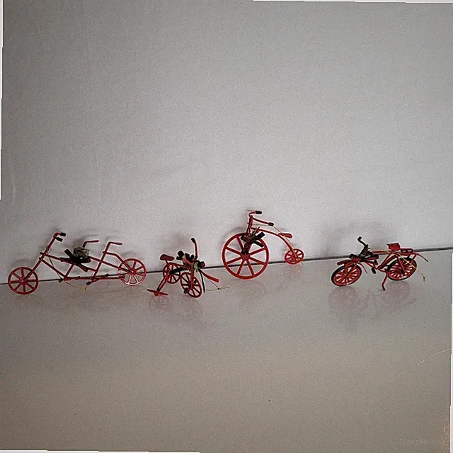 Vintage Miniature Red Metal Bicycle, Tandem bike, And 2 Tricycles. Lot of 4